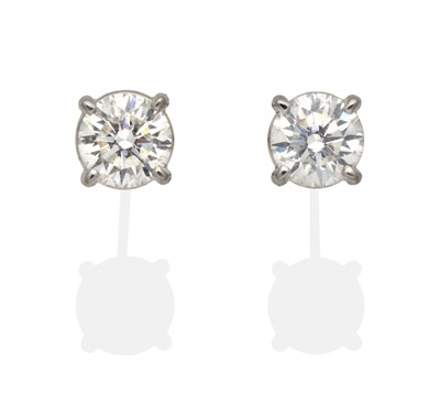 Lot 446 - A Pair of 18 Carat Gold Solitaire Diamond Earrings, round brilliant cut diamonds in claw...