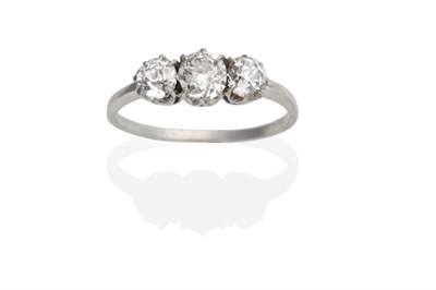 Lot 461 - A Three Stone Diamond Ring, graduated old cut diamonds in claw settings, to knife edge...