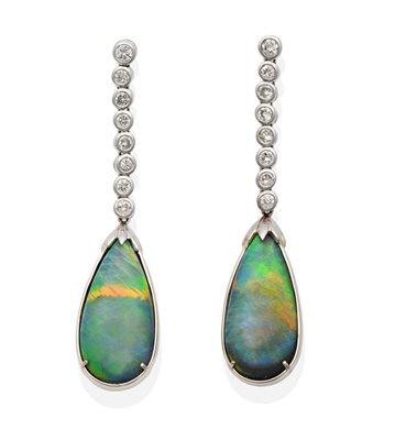 Lot 474 - A Pair of Black Opal and Diamond Pendant Earrings, an articulated row of graduated round...