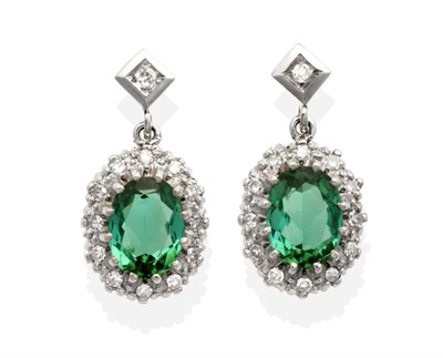 Lot 479 - A Pair of Green Tourmaline and Diamond Cluster Earrings, an eight-cut diamond in a square...