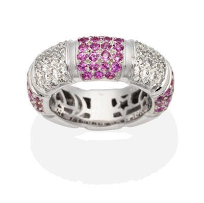 Lot 481 - A Pink Sapphire and Diamond Hoop Ring, bands of alternating pavé set round cut pink...