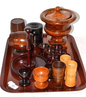 Lot 60 - A tray of assorted treen including egg cups, turned barrels, lignum vitae turned box etc