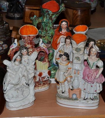 Lot 87 - Five Victorian Staffordshire figures/spill vases