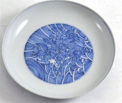Lot 109 - A Chinese blue and white saucer dish decorated with a dragon, of recent date