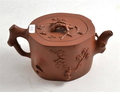 Lot 113 - Red earthenware teapot decorated with prunus
