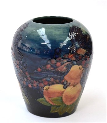 Lot 582 - Sally Tuffin (British, b.1938) for Moorcroft Pottery: A Finches Pattern Vase, on a blue ground,...