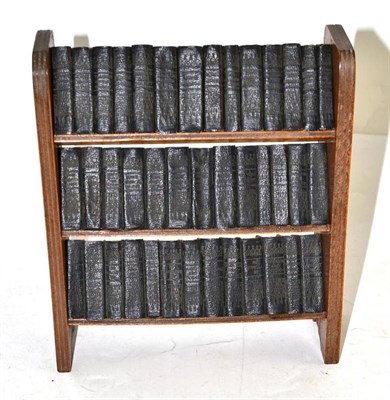 Lot 117 - A miniature bookshelf containing forty miniature William Shakespeare books