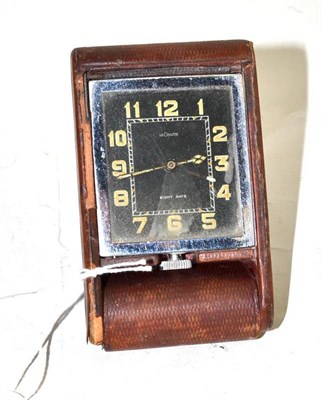 Lot 124 - A Jaeger Le Coultre travel clock with leather case and black dial, circa 1930, eight day...