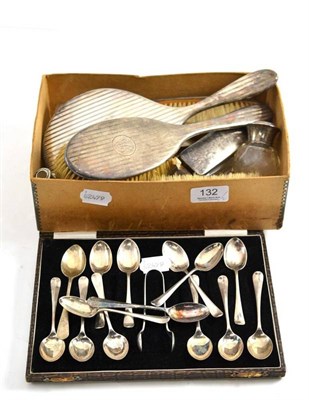 Lot 132 - A cased set of silver teaspoons and a pair of sugar tongs, silver mounted four piece dressing...