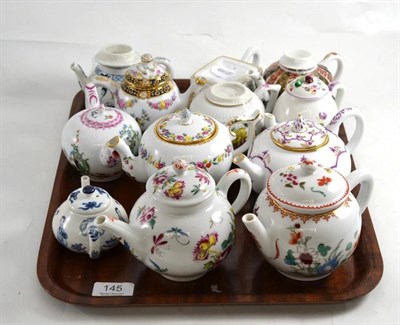 Lot 145 - A set of twelve Victoria and Albert Museum reproduction porcelain tea pots