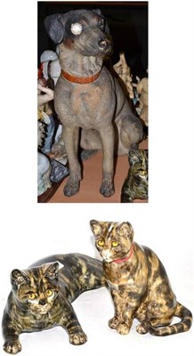 Lot 154 - An early 20th century plaster figure of a Terrier dog and two glazed Whitworth cat ornaments
