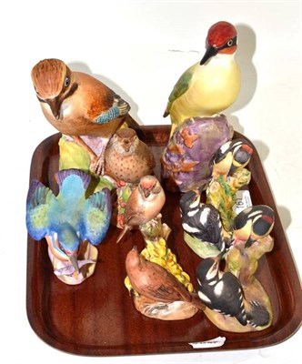 Lot 161 - Seven Royal Worcester birds: Pied Woodpeckers (x2), Kingfisher, Linnets, Thrush, Woodpecker and...