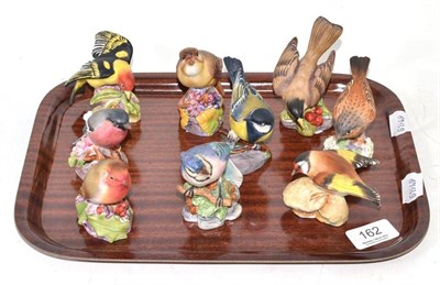 Lot 162 - Nine Royal Worcester birds: Gold Finch, Hedge Sparrow, American Robin, Blue Jay, Great Tit,...