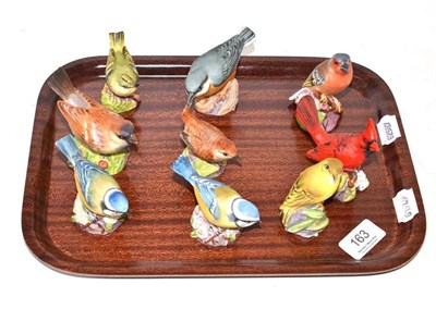 Lot 163 - Nine Royal Worcester birds: Chaffinch, Wood Warbler, Red Cardinal, Blue Tit (x2), Wren,...