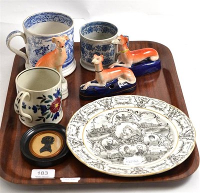 Lot 183 - Tray of 19th century blue and white mugs, Staffordshire dogs, Queen Victoria plate etc