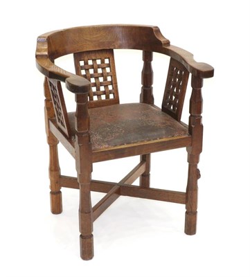 Lot 663 - Mouseman: A Robert Thompson English Oak Monk's Chair, with curved back and shaped arms, over...