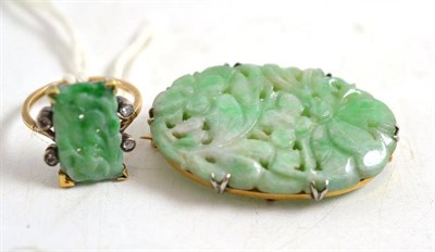 Lot 226 - A carved jade and diamond ring stamped '15CT', and a carved jade brooch (2)