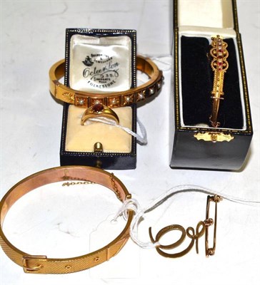 Lot 232 - Three bangles, an 18ct gold ring and a 9ct gold bar brooch