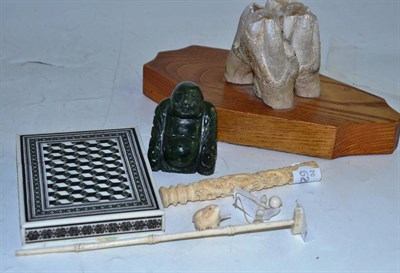 Lot 234 - A walrus tooth on stand, a Cairo card case, a jade type Buddha and three small ivory/bone...