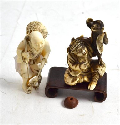 Lot 238 - Two Japanese carved elephant ivory okimonos, circa 1910