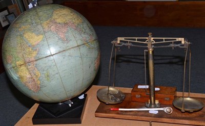 Lot 255 - Phillips challenge globe, a set of brass scales with weights and a clay pipe