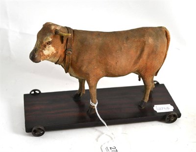 Lot 271 - A 19th century leather model of a cow on a pull-along platform