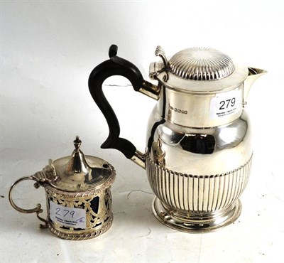 Lot 279 - A silver hot water jug and silver salt pot with blue glass liner