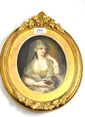 Lot 284 - A 19th century Continental oval plaque depicting a lady wearing a green dress