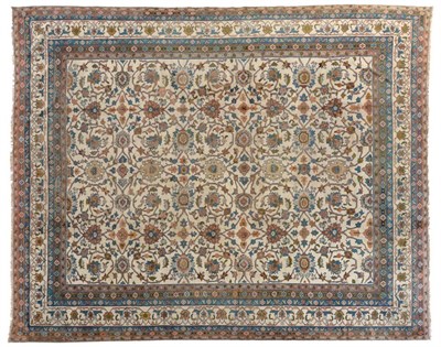 Lot 796 - Indian Carpet of unusual size, circa 1920 The ivory field with an allover design of scrolling vines