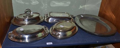 Lot 334 - Pewter charger, two pewter serving dishes and four plated serving dishes with covers