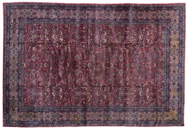 Lot 803 - Indian Carpet, circa 1910 The raspberry field with an allover one way design of serrated...