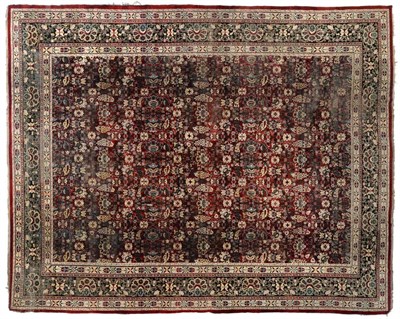 Lot 812 - Agra Carpet Central/North India, late 19th century The abrashed raspberry field with an allover...