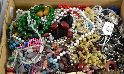 Lot 371 - A box of assorted costume jewellery - mainly bead necklaces, including a cherry amber type necklace