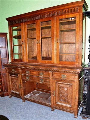 Lot 396 - Late 19th/early 20th century oak sideboard with later glazed top