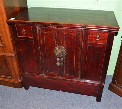 Lot 398 - A Chinese sideboard with an arrangement of cupboards and drawers