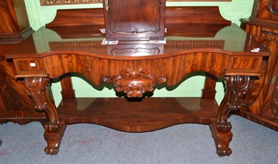 Lot 405 - Victorian carved mahogany serpentine shaped console table