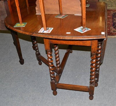 Lot 414 - Oak gateleg table with spiral turned legs