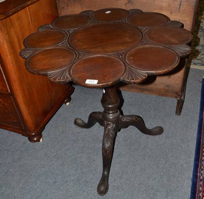 Lot 423 - A carved mahogany tripod table