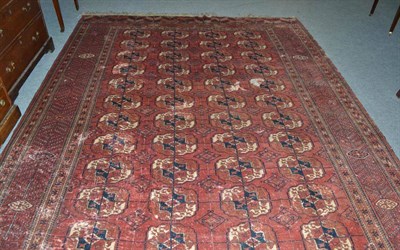 Lot 433 - Tekke carpet, Emirate of Bokhara, the soft madder field with four rows of quartered guls...