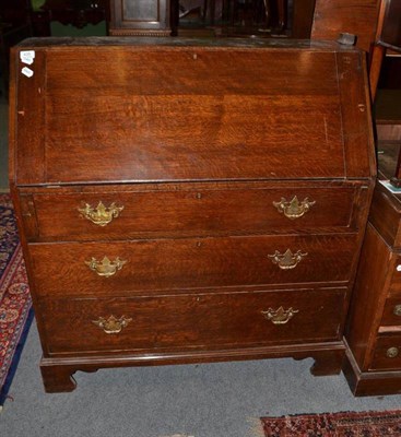 Lot 435 - A 19th century oak bureau