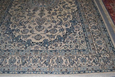 Lot 441 - Cream and blue ground patterned carpet