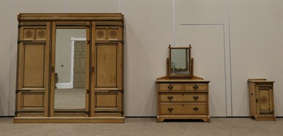 Lot 859 - A Lamb of Manchester Ash and Ebonised Aesthetic Three Piece Bedroom Suite, comprising a triple door