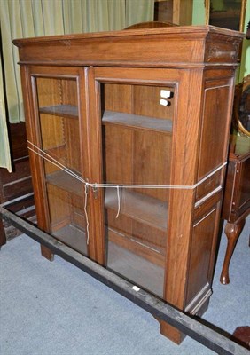 Lot 476 - Glazed oak bookcase