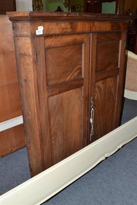 Lot 480 - A George III mahogany double door hanging corner cupboard