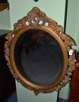 Lot 483 - An oval gilt mirror