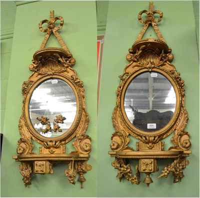 Lot 494 - A pair of ornamental bracket mirrors