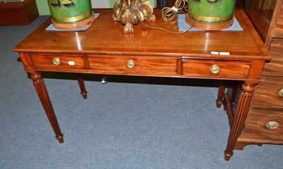 Lot 507 - Mid-19th century mahogany writing table fitted with three drawers on turned and reeded legs