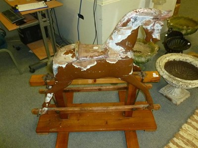 Lot 572 - Rocking horse on pine stand (in need of restoration)