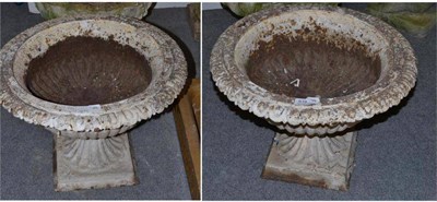 Lot 619 - A pair of cast iron campana garden urns