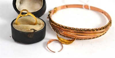 Lot 17 - A bangle and three damaged rings (4)